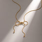 NUEVO - Cadena Dulce Encanto en Acero Inoxidable Estilo Bow Bañado en Oro